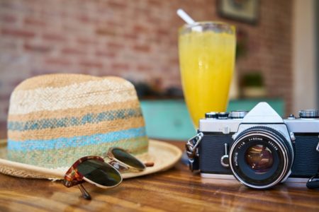 hat, camera, and cocktail